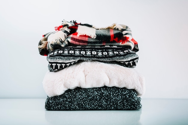 Free photo stack of warm woolen clothes