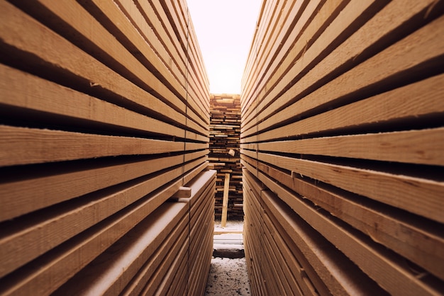 Stack of wooden planks in sawmill lumber yard