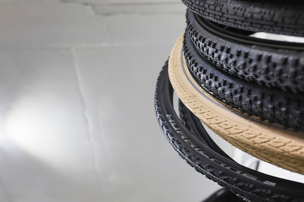 Stacked bicycle tires in workshop