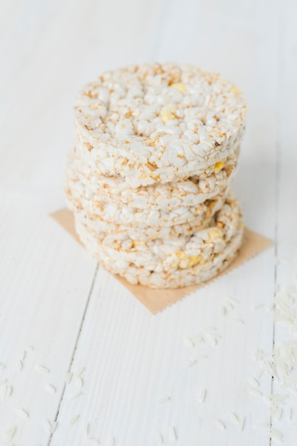 Stacked of puffed rice cakes on wooden table
