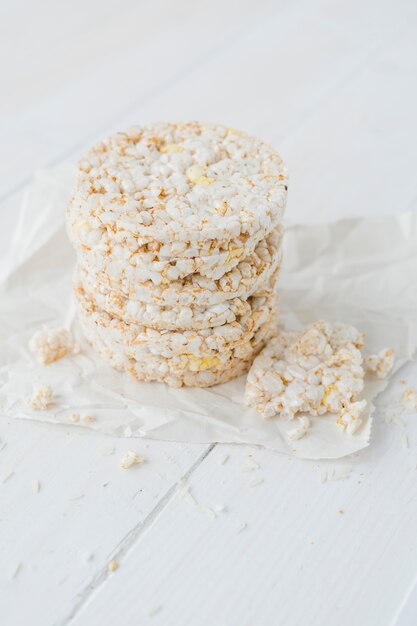 Stacked of puffed rice on wooden desk