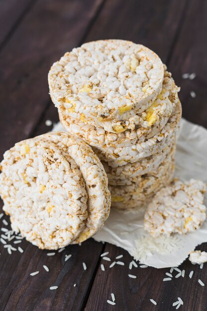 Stacked of round cake with grains on wooden table