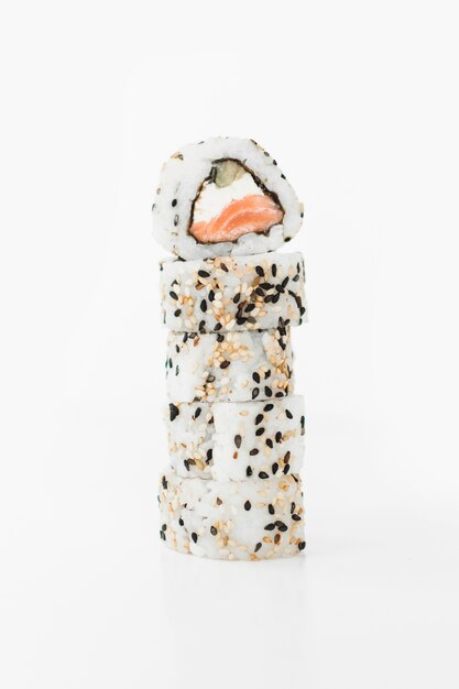 Stacked of sushi roll with sesame seeds on white background