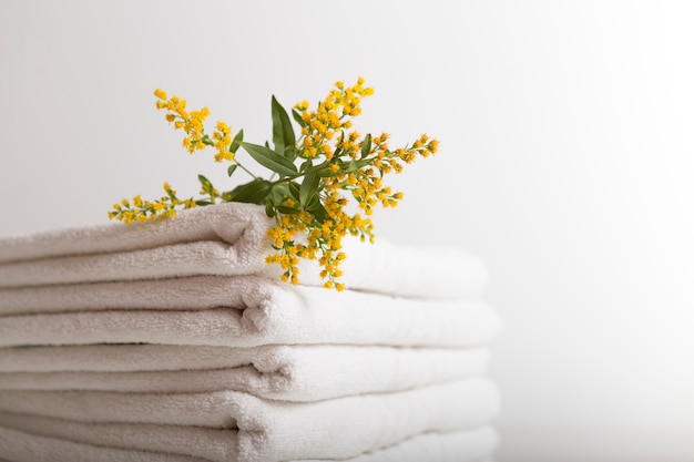 Free photo stacked white towels