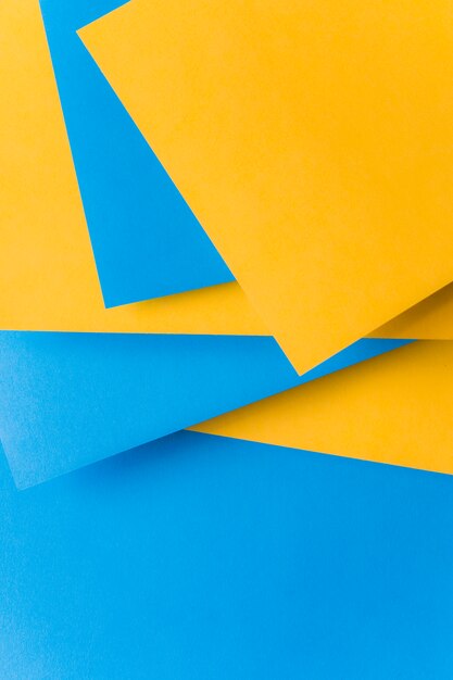 Stacked of yellow and blue card paper backdrop
