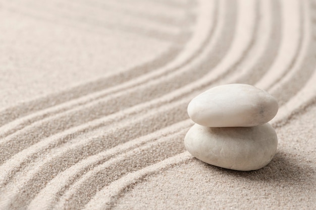 Free Photo stacked zen marble stones sand background in mindfulness concept