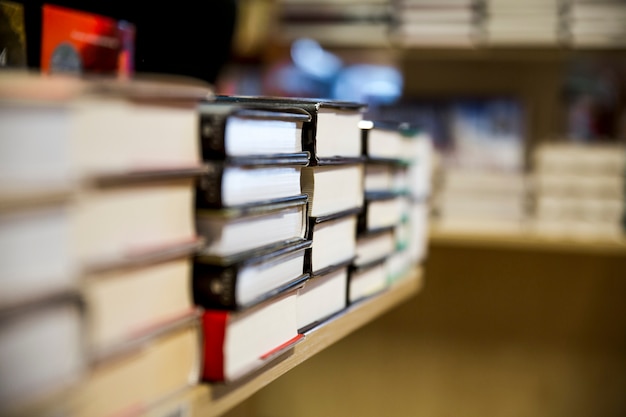 Free photo stacks of books on shelves