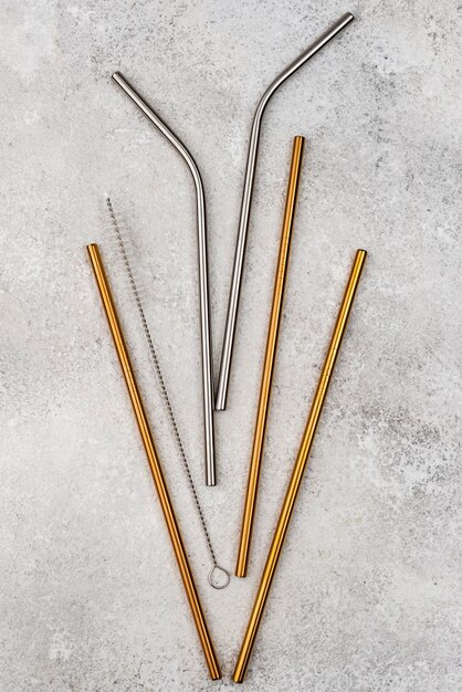 Stainless metallic straws flat lay