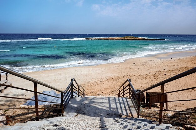 Stairs leading to an empty beach