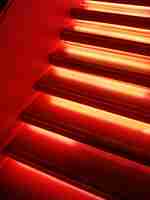 Free photo stairs in red neon light