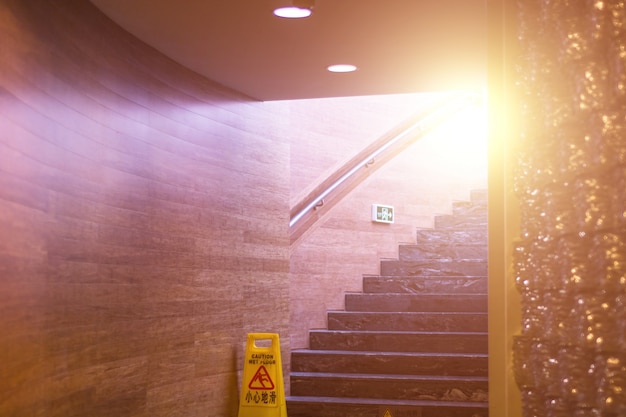 Stairs with caution sign