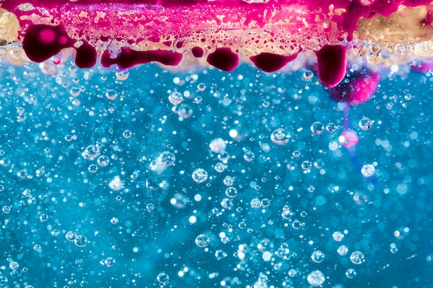 Stalactite underwater with bubbles