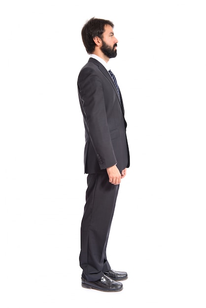 Standing businessman over isolated white background