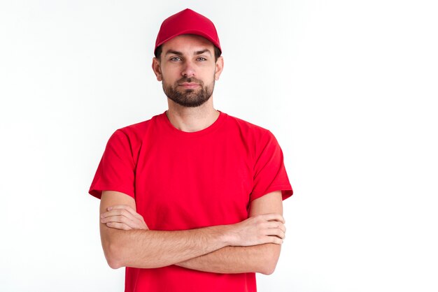 Standing courier man having his arms crossed