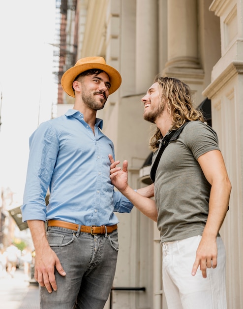 Standing male laughing at each other joke