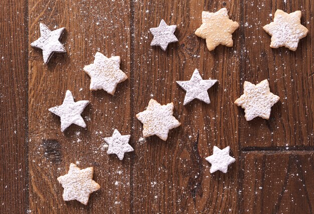 Star shaped gingerbread cookies with powdered sugar