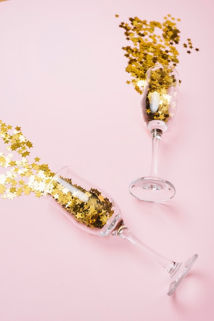 Star spangles scattered from glasses on table 