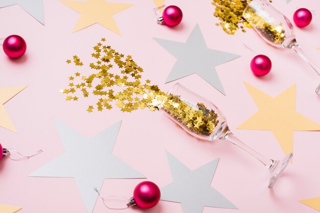 Star spangles scattered from glasses with shiny baubles