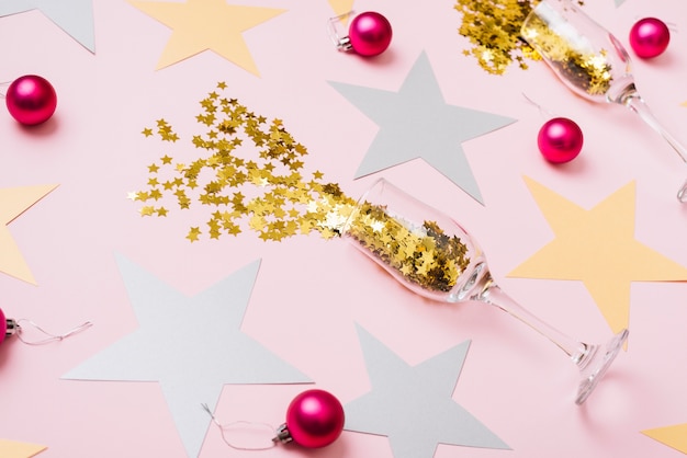 Star spangles scattered from glasses with shiny baubles