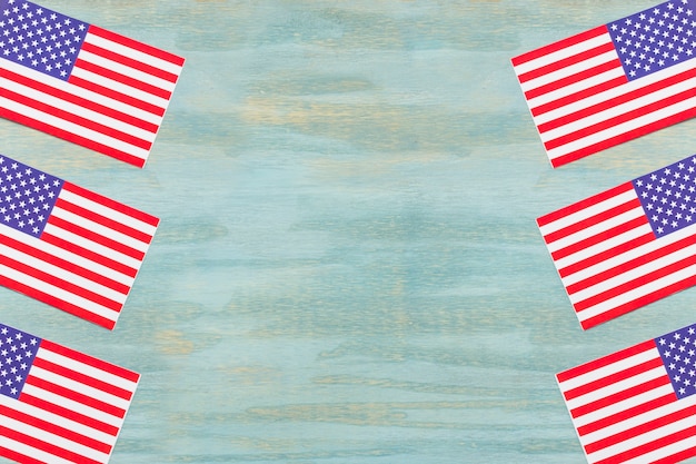 Stars and stripes on an american flags over the wooden textured backdrop