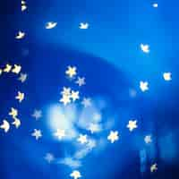 Free photo stars swirling on blue background