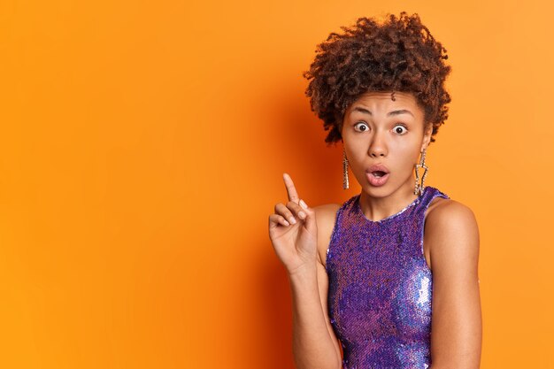 Startled beautiful African American woman with curly hair