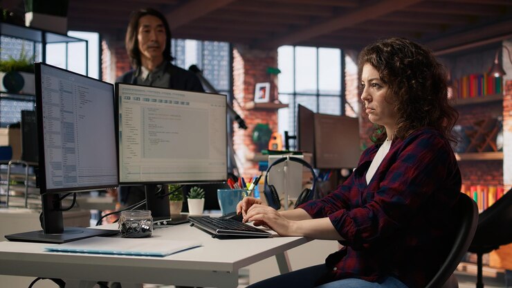 Free Photo startup engineer conducting detailed code review to fix bugs