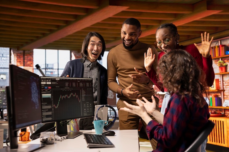 Free Photo startup team celebrating in office watching market stock surging