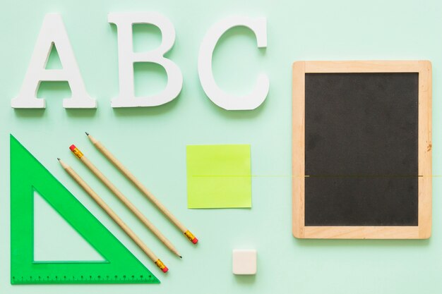 Stationary with small chalkboard and alphabet letters