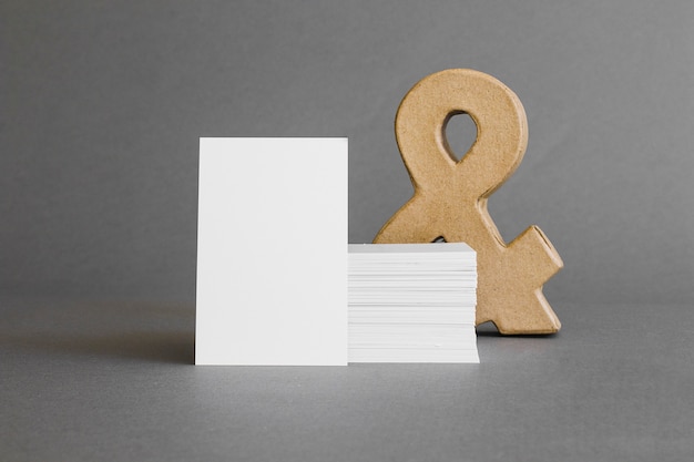 Stationery concept with business cards in front of ampersand