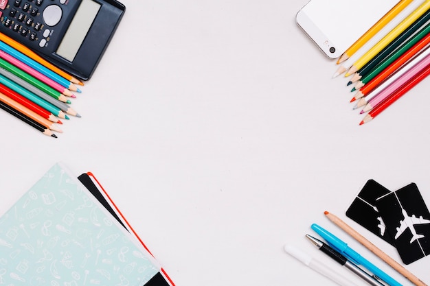 Stationery in corners of white background