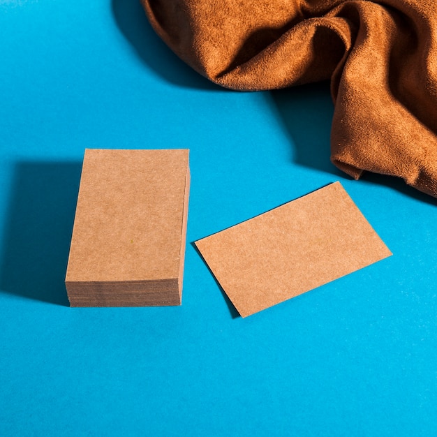 Free photo stationery mockup with cardboard business cards and cloth