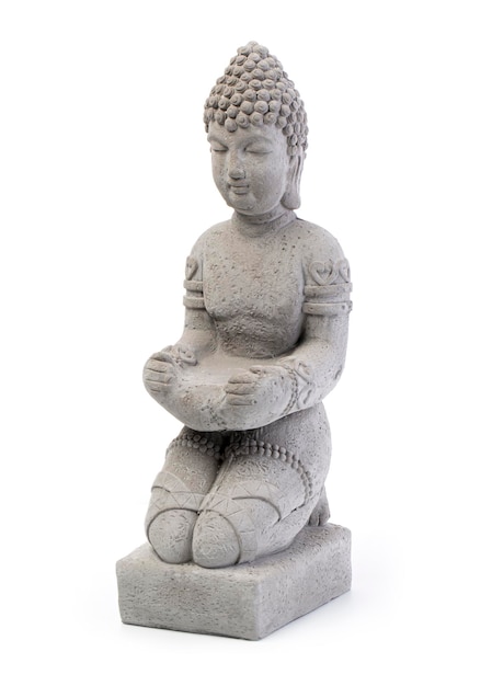 Premium Photo | A statue of buddha sitting on his knees isolated on ...