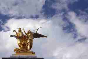 Free photo statue on the grand palais in paris