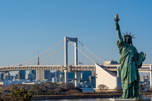 Premium Photo Statue Of Liberty And Rainbow Bridge Located At Odaiba Tokyo Japan