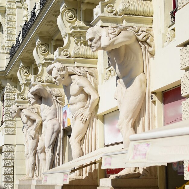 "Statues on side of building"