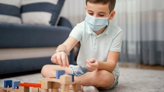 Stay indoors kid playing with toys