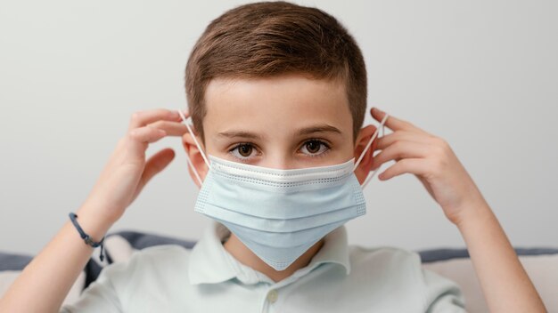 Stay indoors kid wearing medical mask