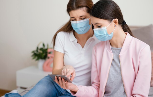 Stay indoors women wearing medical masks