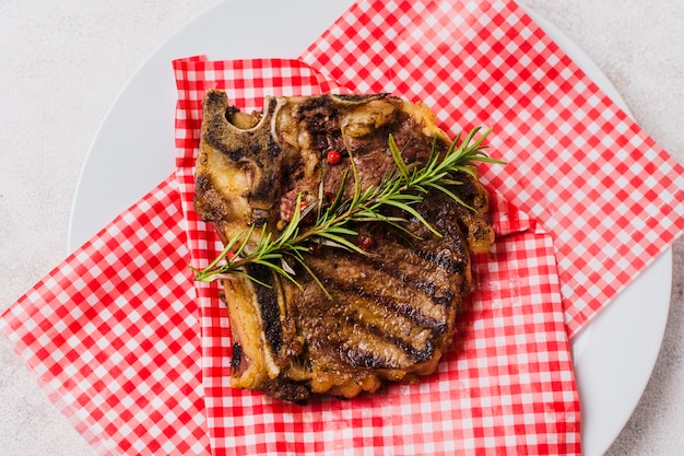 Steak on plate with rosemary