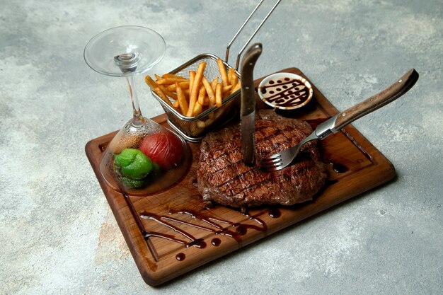 Steak with fries and vegetables