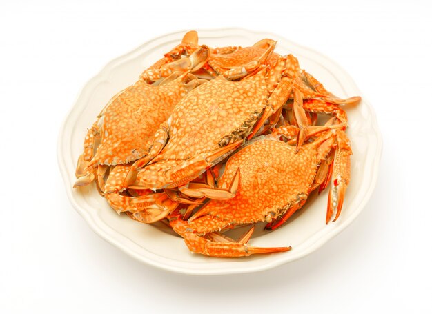 Steamed crabs on white background .