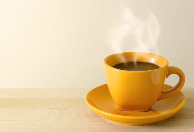 steaming coffee cup on table