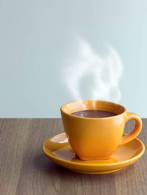 steaming coffee cup on table