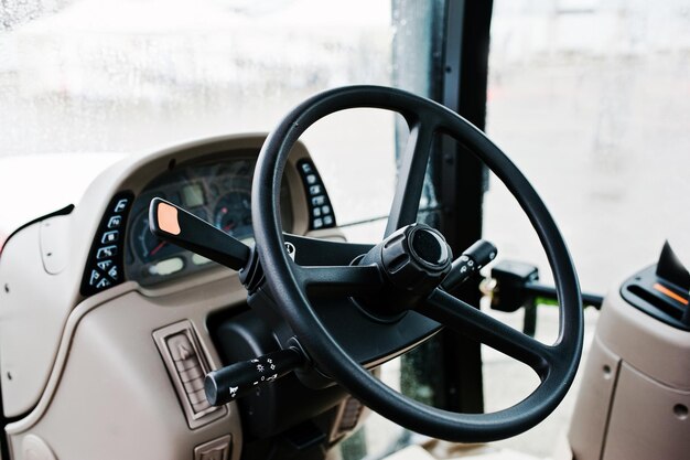 Steering wheel and the controls in the cabin of the new tractor