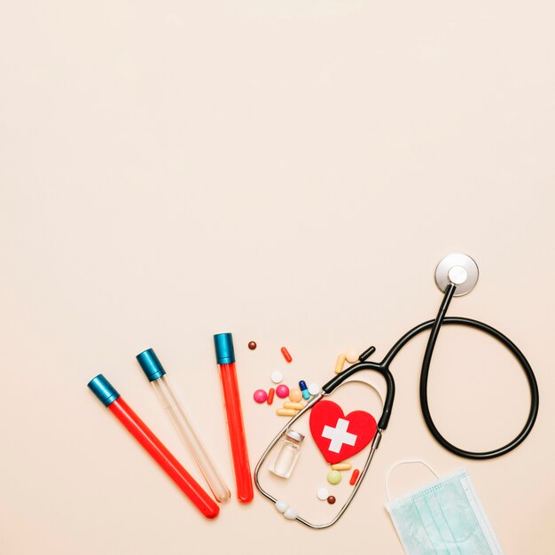 Stethoscope and blood samples near medications