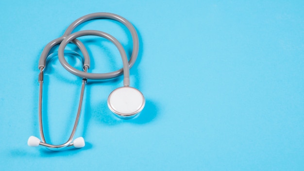 Stethoscope on blue background