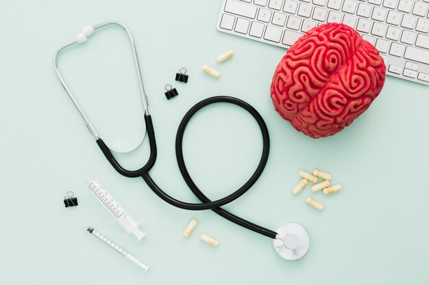 Stethoscope and brain on desk