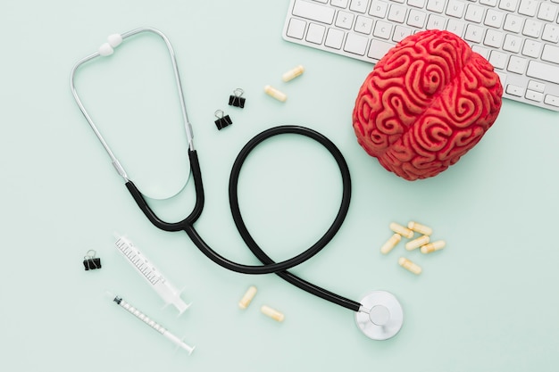 Stethoscope and brain on desk