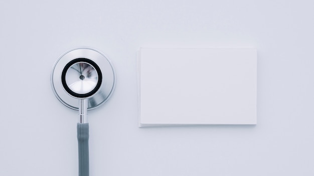 Stethoscope and business card in foreground